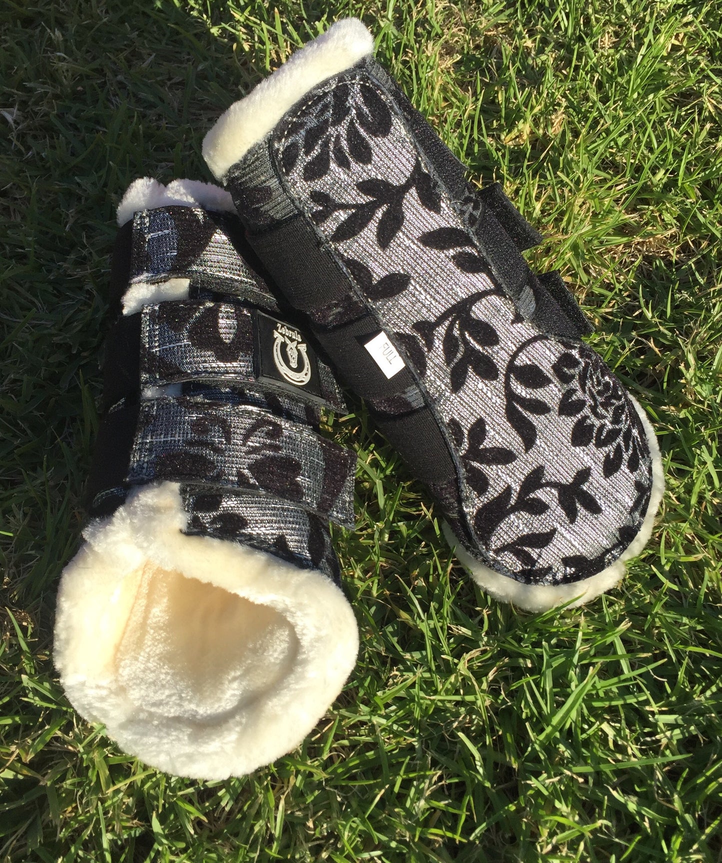 Black and silver brushing boots