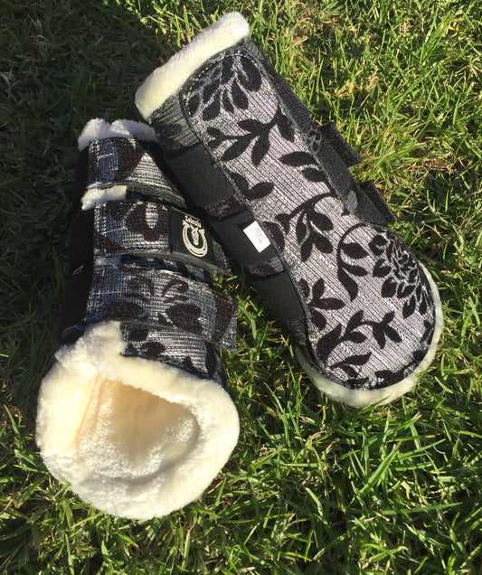 Black and silver brushing boots