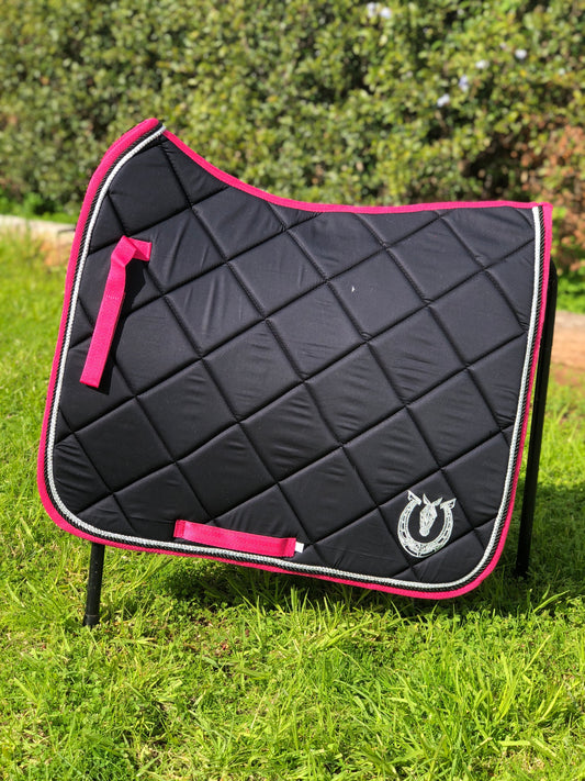 Black dressage pad with hot pink binding